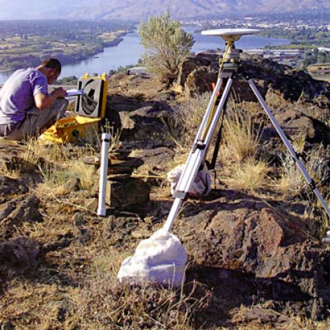 Researcher setting up seismometers